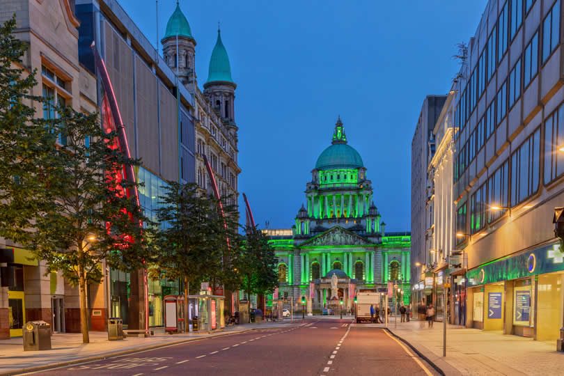 Belfast city hall at night in green colour