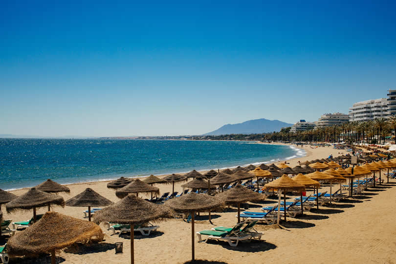 Beach chairs and umbrellas in Marbella