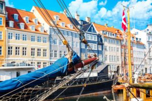 Nyhavn boat and houses in Copenhagen