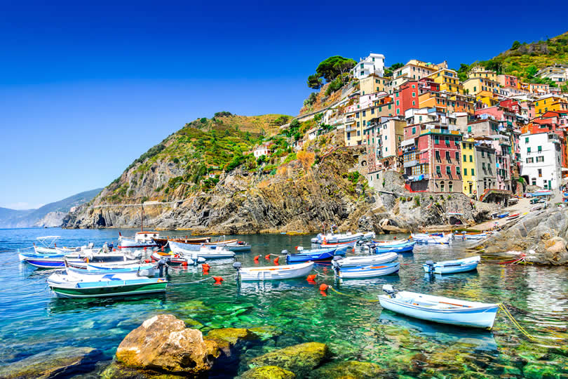 Riomaggiore boats and village in Cinque Terre
