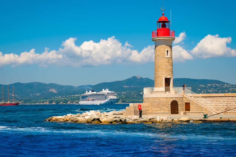 St Tropez harbor lighthouse and cruise ship