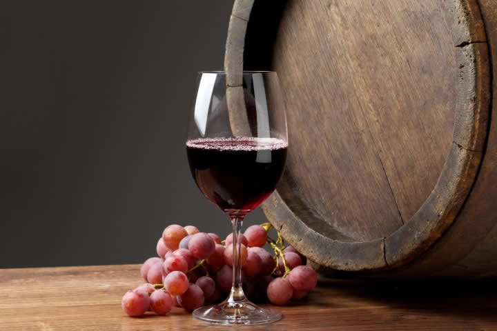 Red wine glass and barrel