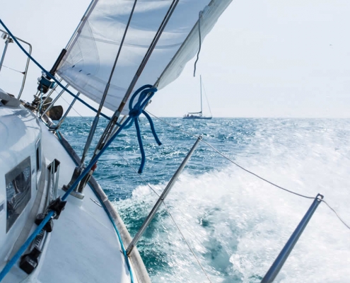 Yacht racing in waves
